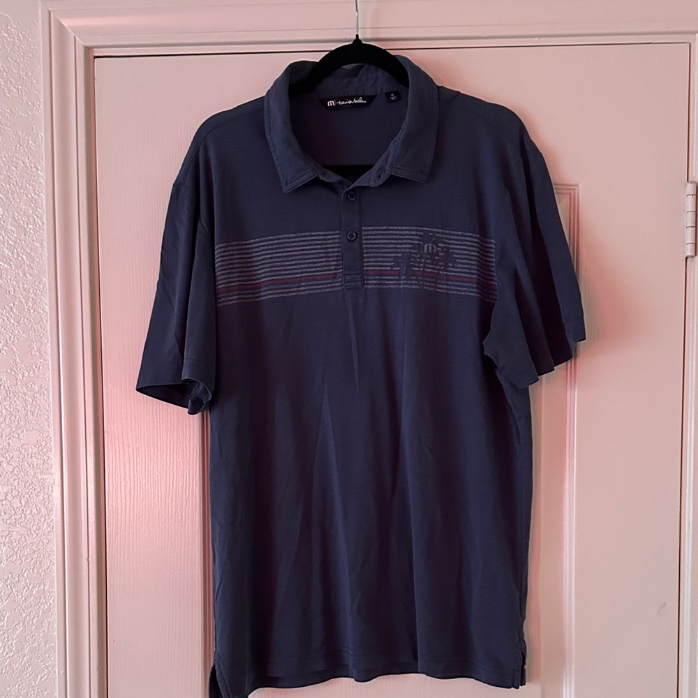 TravisMathew Navy Polo with Subtle Stripe Detail